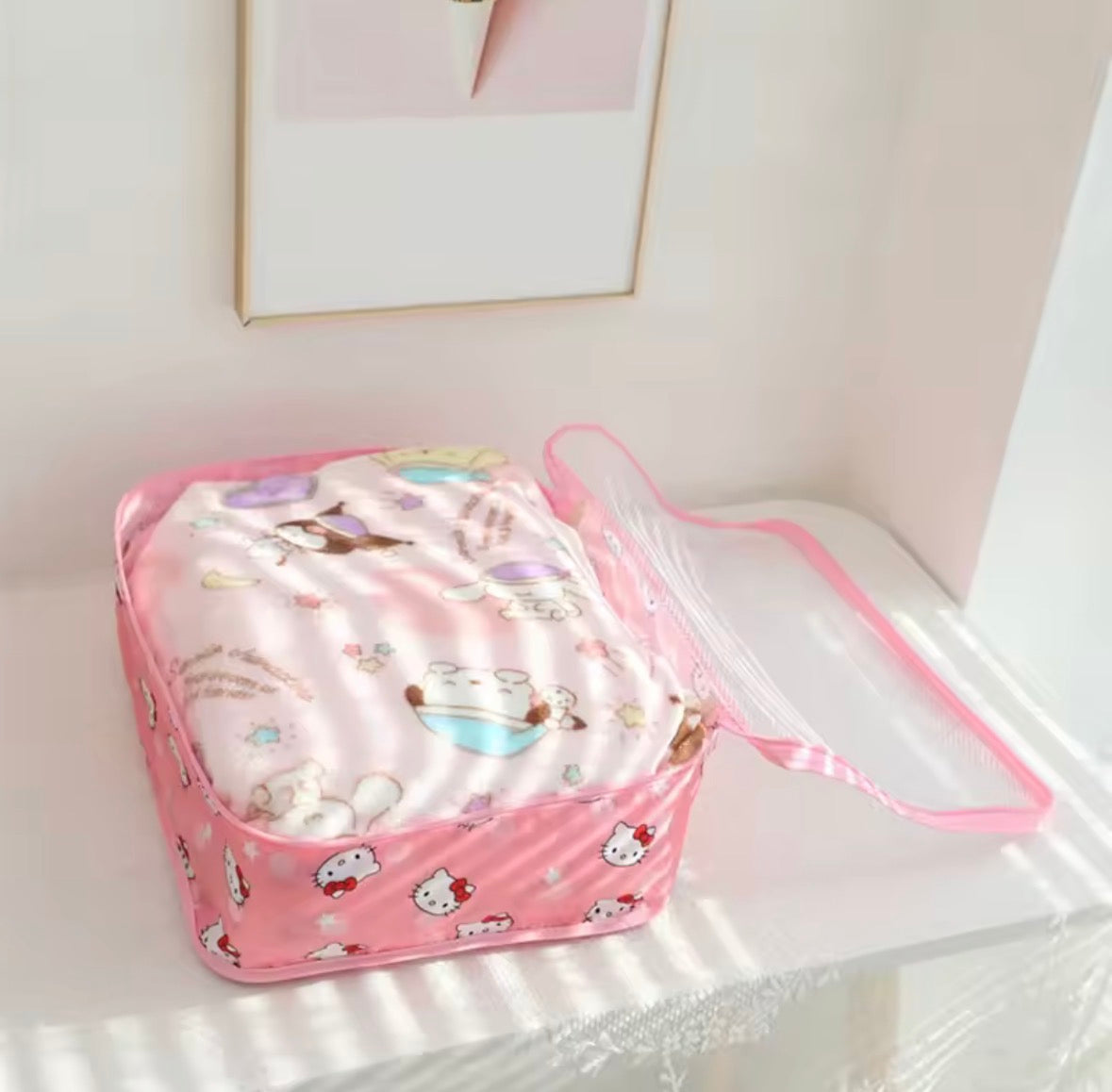 Open suitcase packed neatly with Sanrio packing cubes